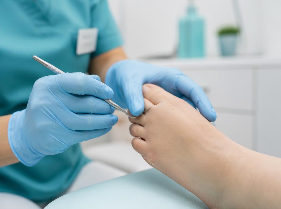 Clinician carrying out a careful foot health assessment